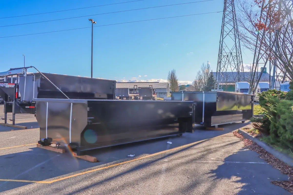 Roll-off dumpster ready for waste disposal at job site for Concrete Dumpster Rental in Myrtle Grove
